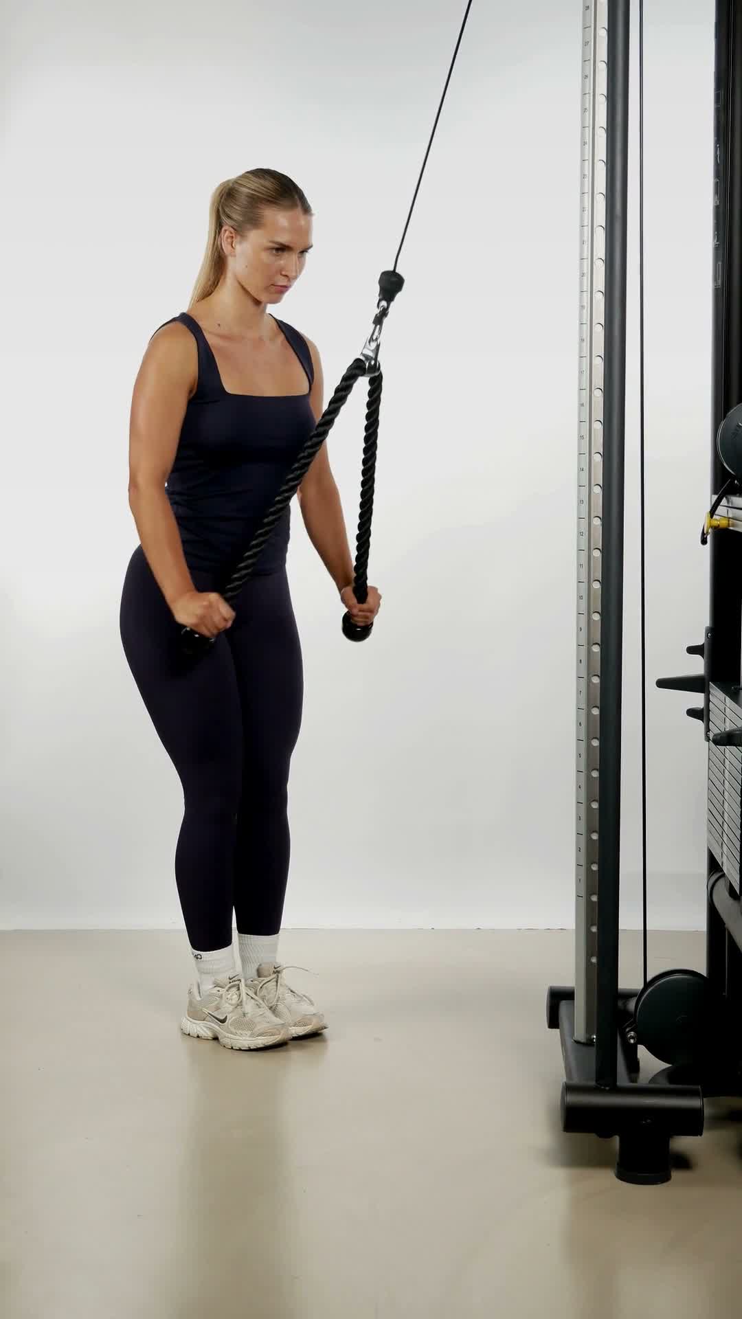 Cable Rope Tricep Pushdown exercise stock photo, triceps