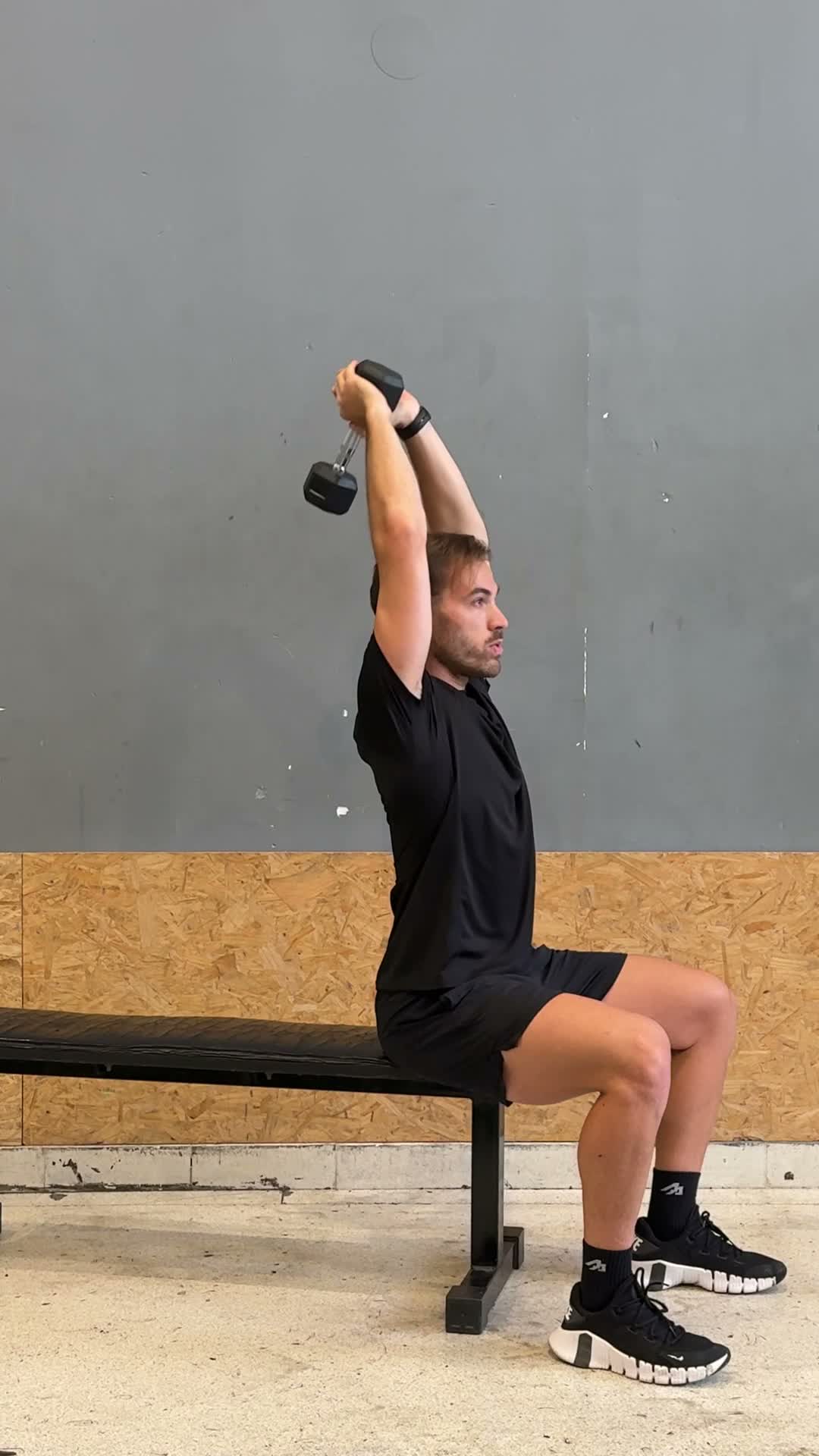 Dumbbell Overhead Tricep Extension exercise stock photo, triceps