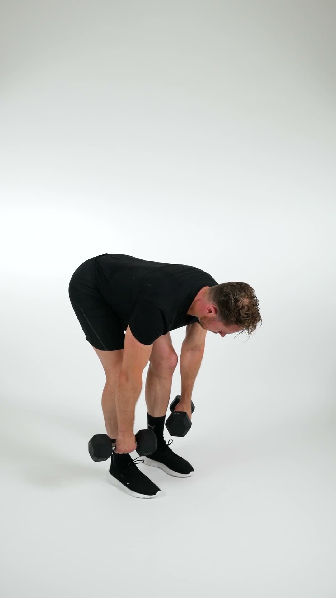 Dumbbell Stiff Leg Deadlift exercise stock photo, hamstrings