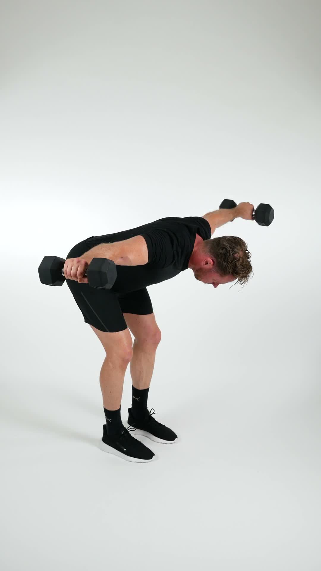 Bent Over Dumbbell Rear Delt Raise exercise stock photo, shoulders